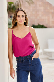 Model Tegand wearing size 10 of the Runaway Top – Plum in colour Plum, in a cropped view