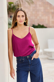 Model Tegand wearing size 10 of the Runaway Top – Plum in colour Plum, in a cropped view