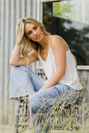 Model Tegan wearing size 10 of the Runaway Top in colour White (White), from the front, showing the whole outfit