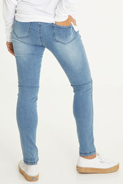 Model Cara wearing size 10 of the Wild Plains Stitched Jeggings in colour MidDenim (Blue), from the back