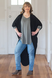 Model Katie wearing size 10 of the Wild Plains Stitched Jeggings in colour MidDenim (Blue), from the front, showing the whole outfit