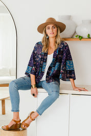 Model Tegan wearing size 10 of the Wild Plains Stitched Jeggings in colour MidDenim (Blue), from the front, showing the whole outfit