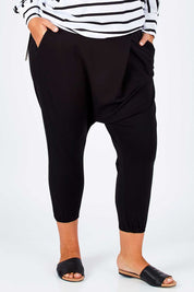 Model Fiona wearing size 16 of the Relax With Me Pants in colour Black (Black), from the front, cropped image