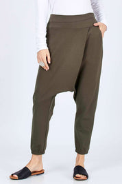 Model Georgia wearing size 10 of the Relax With Me Pants in colour Olive (Green), from the front, cropped image