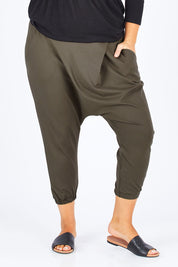 Model Natalia wearing size 14 of the Relax With Me Pants in colour Olive (Green), from the front, cropped image