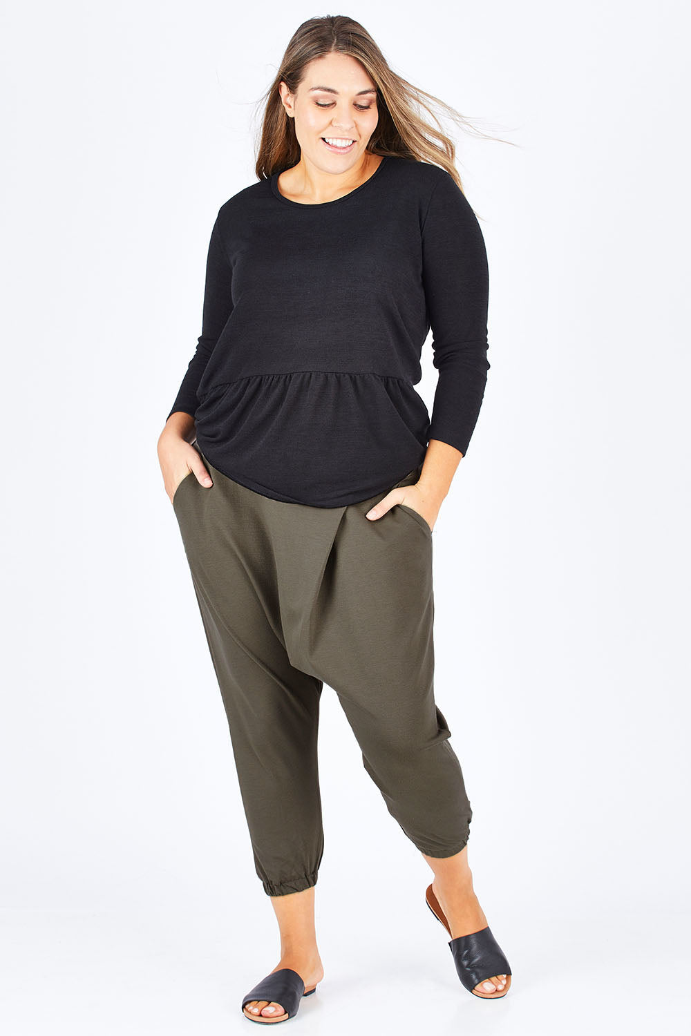 Model Natalia wearing size 14 of the Relax With Me Pants in colour Olive (Green), from the front, showing the whole outfit