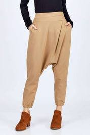 Model Georgia wearing size 10 of the Relax With Me Pants in colour Tobacco, from the front, cropped image