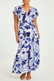 Model Noli wearing size 14 of the Bellezza Maxi Dress in colour Blues (Blue), from the front, cropped image