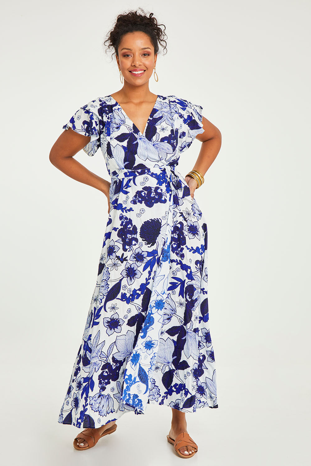 Model Noli wearing size 14 of the Bellezza Maxi Dress in colour Blues (Blue), from the front, showing the whole outfit