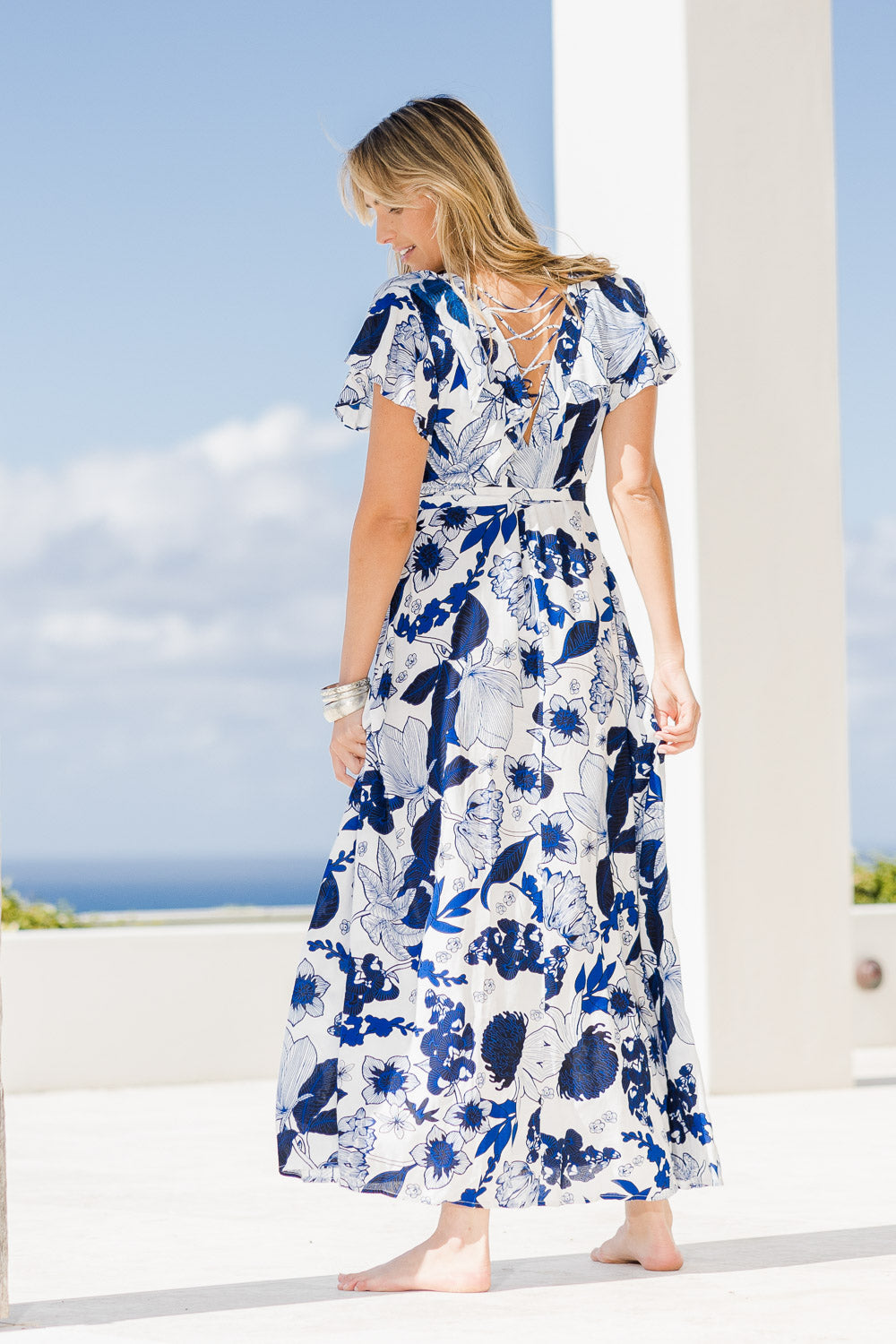 Model Tegan wearing size 10 of the Bellezza Maxi Dress in colour Blues (Blue), from the front, showing the whole outfit