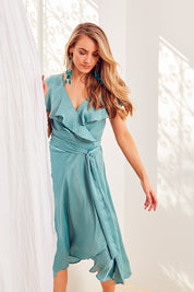 Model Marnee wearing size 10 of the Amore Wrap Dress in colour Teal (Green), from the front, showing the whole outfit