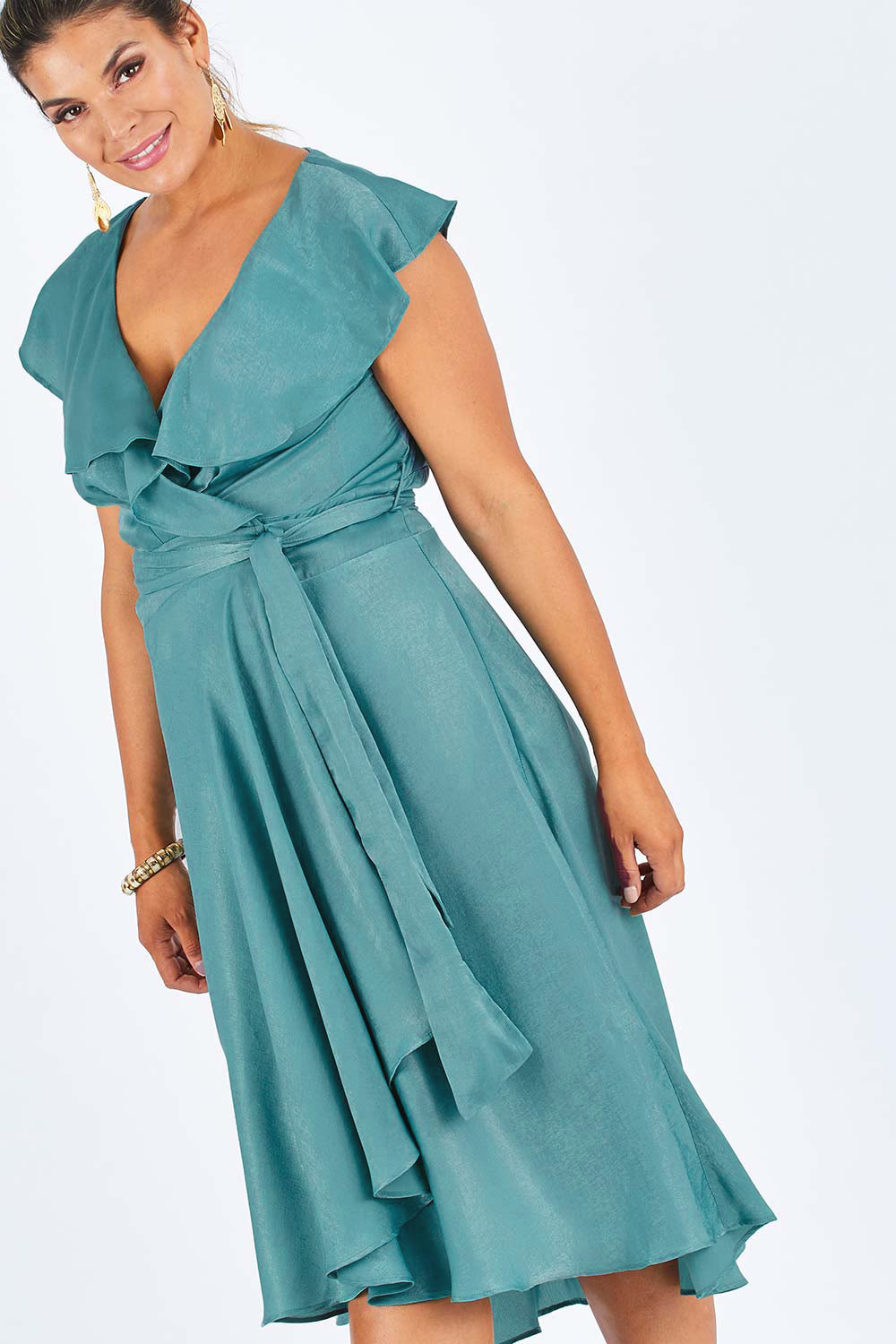 Model Palatina wearing size 14 of the Amore Wrap Dress in colour Teal (Green), from the front, cropped image