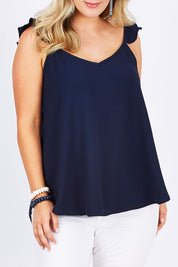 Model Jess wearing size 14 of the Romance All Around Top in colour Navy (Blue), from the front, cropped image