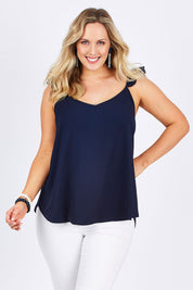 Model Jess wearing size 14 of the Romance All Around Top in colour Navy (Blue), from the front, cropped image