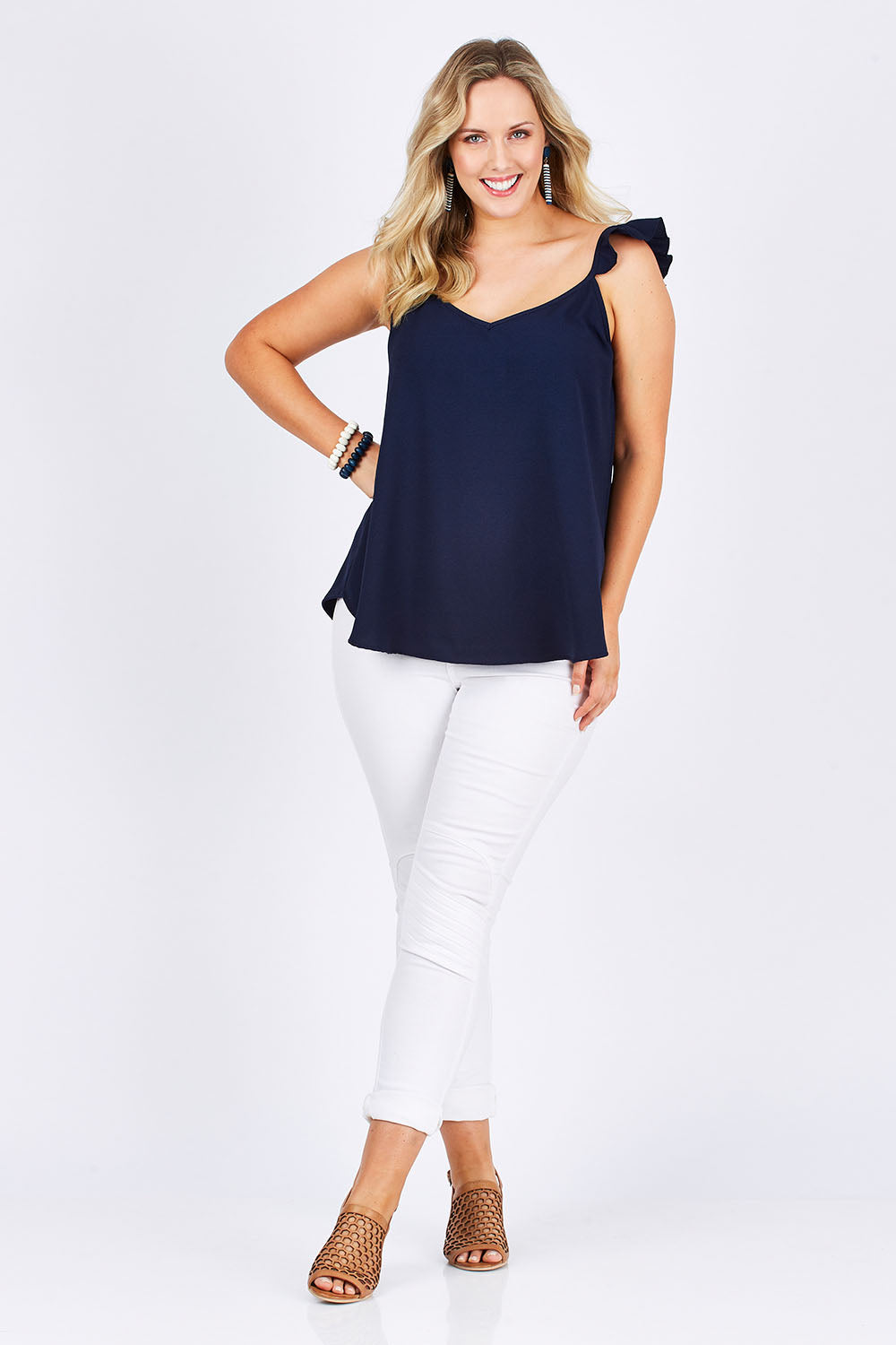 Model Jess wearing size 14 of the Romance All Around Top in colour Navy (Blue), from the front, showing the whole outfit
