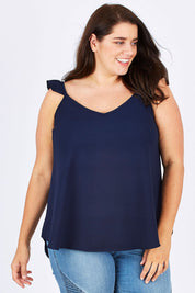 Model Mae wearing size 18 of the Romance All Around Top in colour Navy (Blue), from the front, cropped image