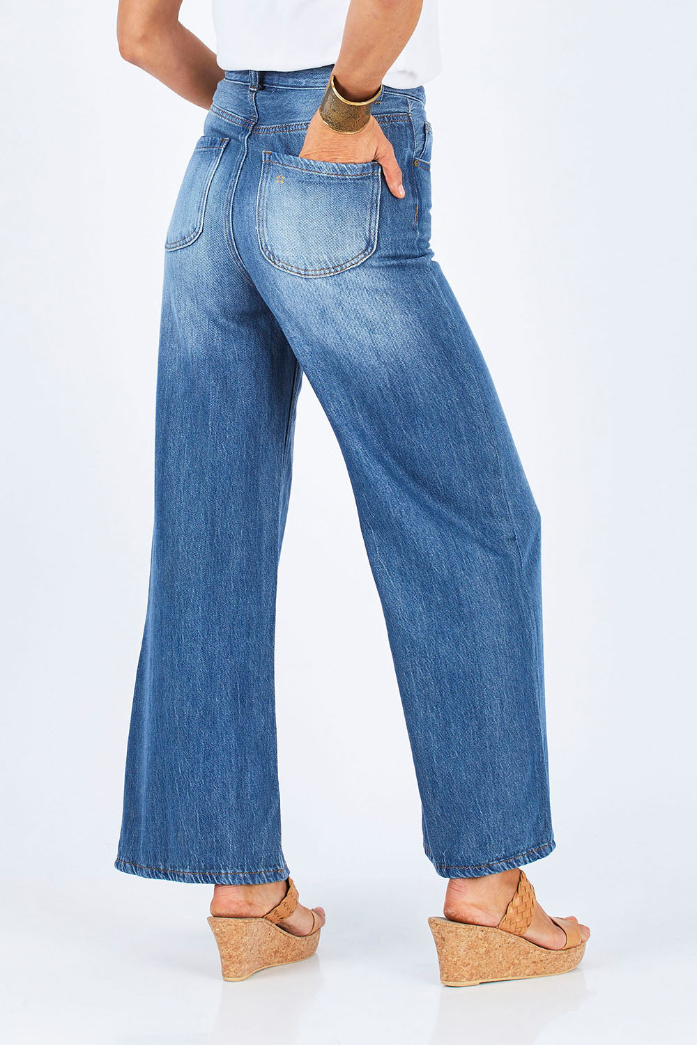 Model Gemma wearing size 10 of the Happy Me Wide Leg Jeans in colour Denim (Blue), from the back