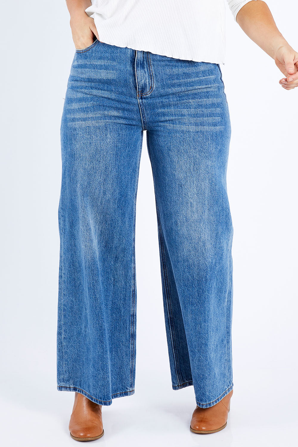 Model Laura wearing size 14 of the Happy Me Wide Leg Jeans in colour Denim (Blue), from the front, cropped image