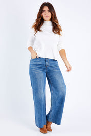 Model Laura wearing size 14 of the Happy Me Wide Leg Jeans in colour Denim (Blue), from the front, showing the whole outfit