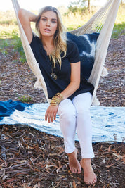 Model Olivia wearing size 12 of the Walking On Clouds Tee in colour JetBlack (Black), from the front, showing the whole outfit