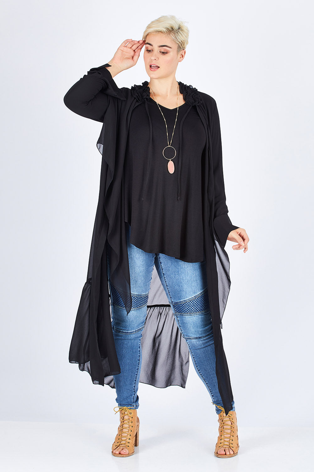 Model Stefania wearing size 14 of the Breezing Along Duster in colour Black (Black), from the front, showing the whole outfit