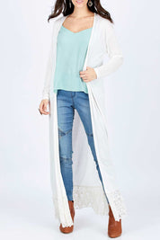 Model Georgia wearing size 10 of the Starry Night Cardi in colour Chalk (White), from the front, cropped image
