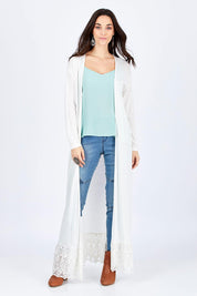 Model Georgia wearing size 10 of the Starry Night Cardi in colour Chalk (White), from the front, showing the whole outfit