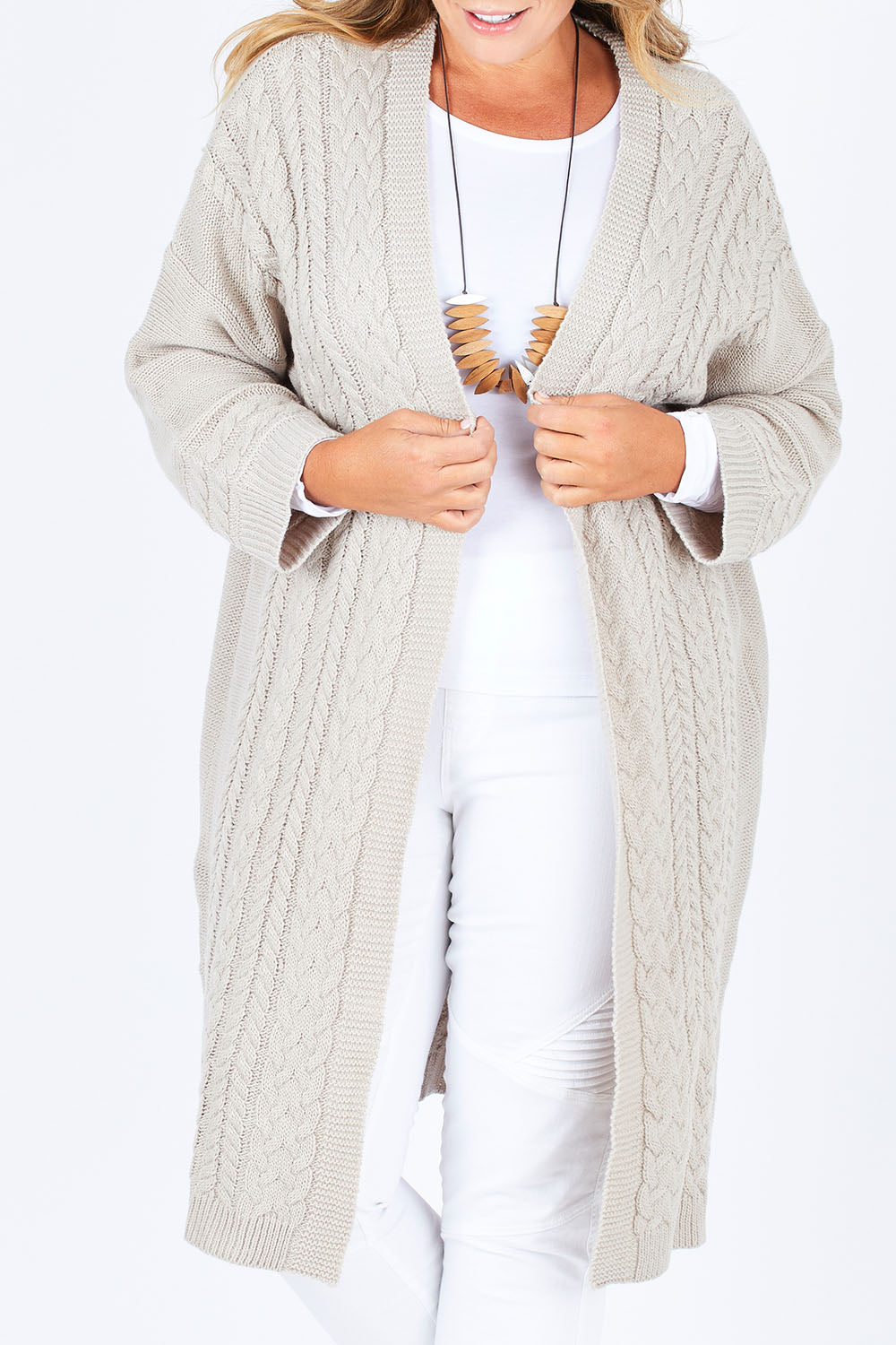 Model Fiona wearing size XL of the Walk In The Park Cardi in colour Sand, from the front, cropped image