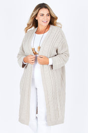 Model Fiona wearing size XL of the Walk In The Park Cardi in colour Sand, from the front, cropped image