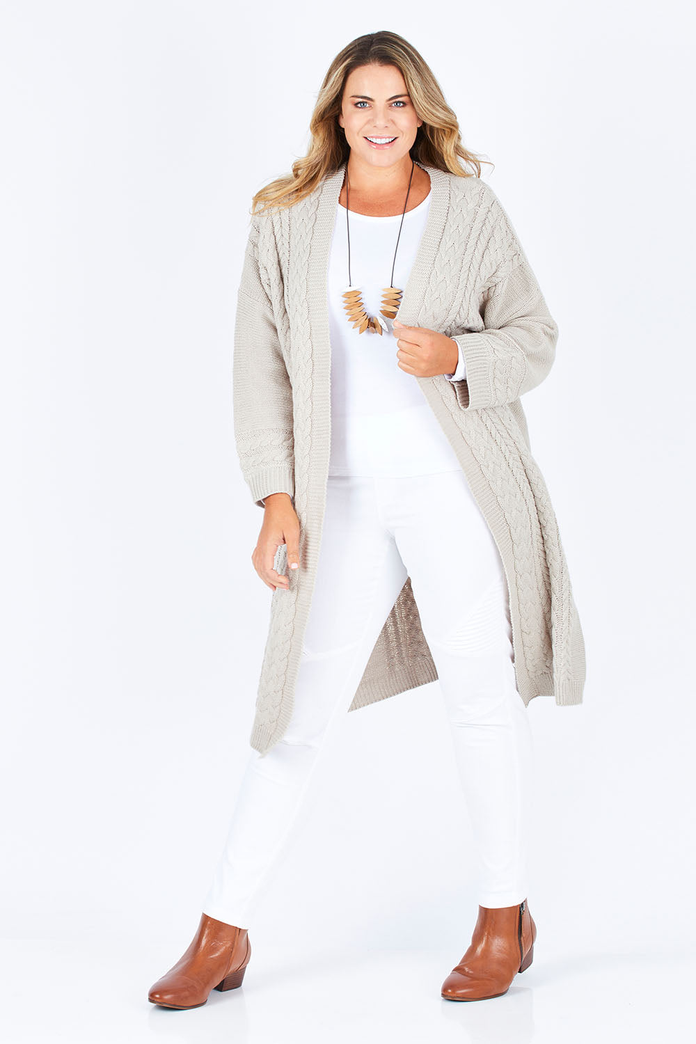 Model Fiona wearing size XL of the Walk In The Park Cardi in colour Sand, from the front, showing the whole outfit