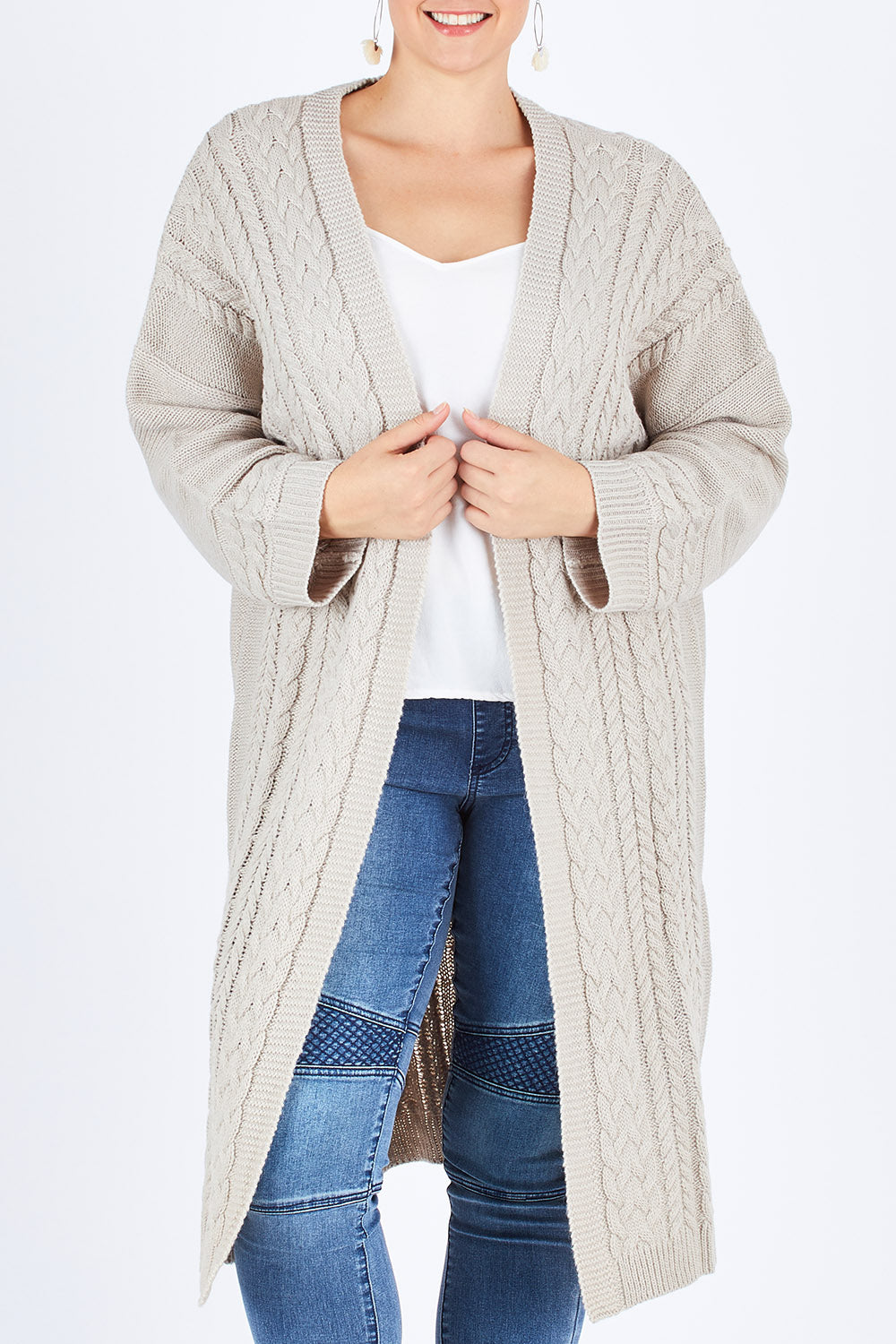 Model Stefania wearing size L of the Walk In The Park Cardi in colour Sand, from the front, cropped image