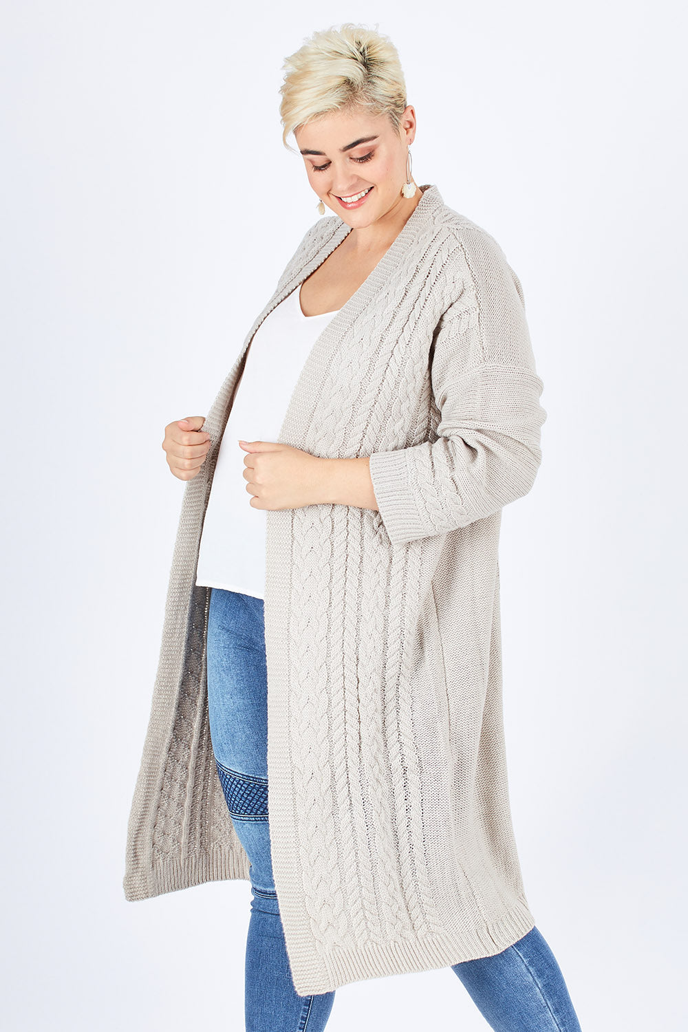 Model Stefania wearing size L of the Walk In The Park Cardi in colour Sand, from the front, cropped image