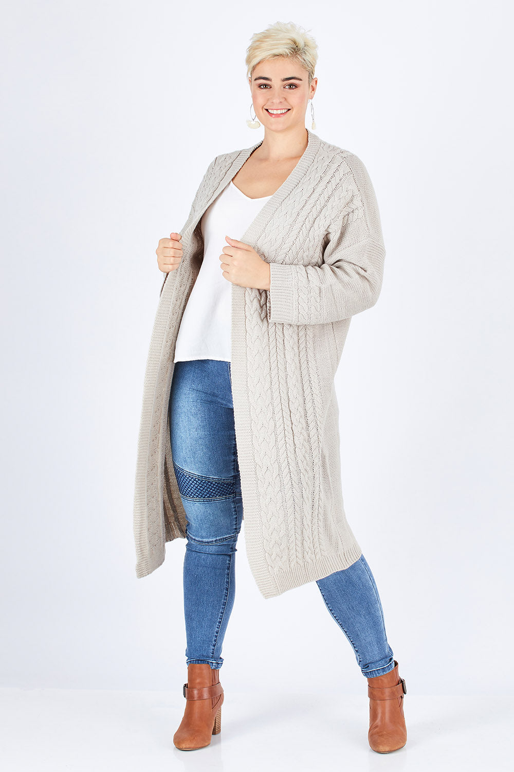 Model Stefania wearing size L of the Walk In The Park Cardi in colour Sand, from the front, showing the whole outfit