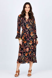 Model Georgia wearing size 10 of the Swanning Around Wrap Dress in colour BlackOrch (Black), from the front, showing the whole outfit