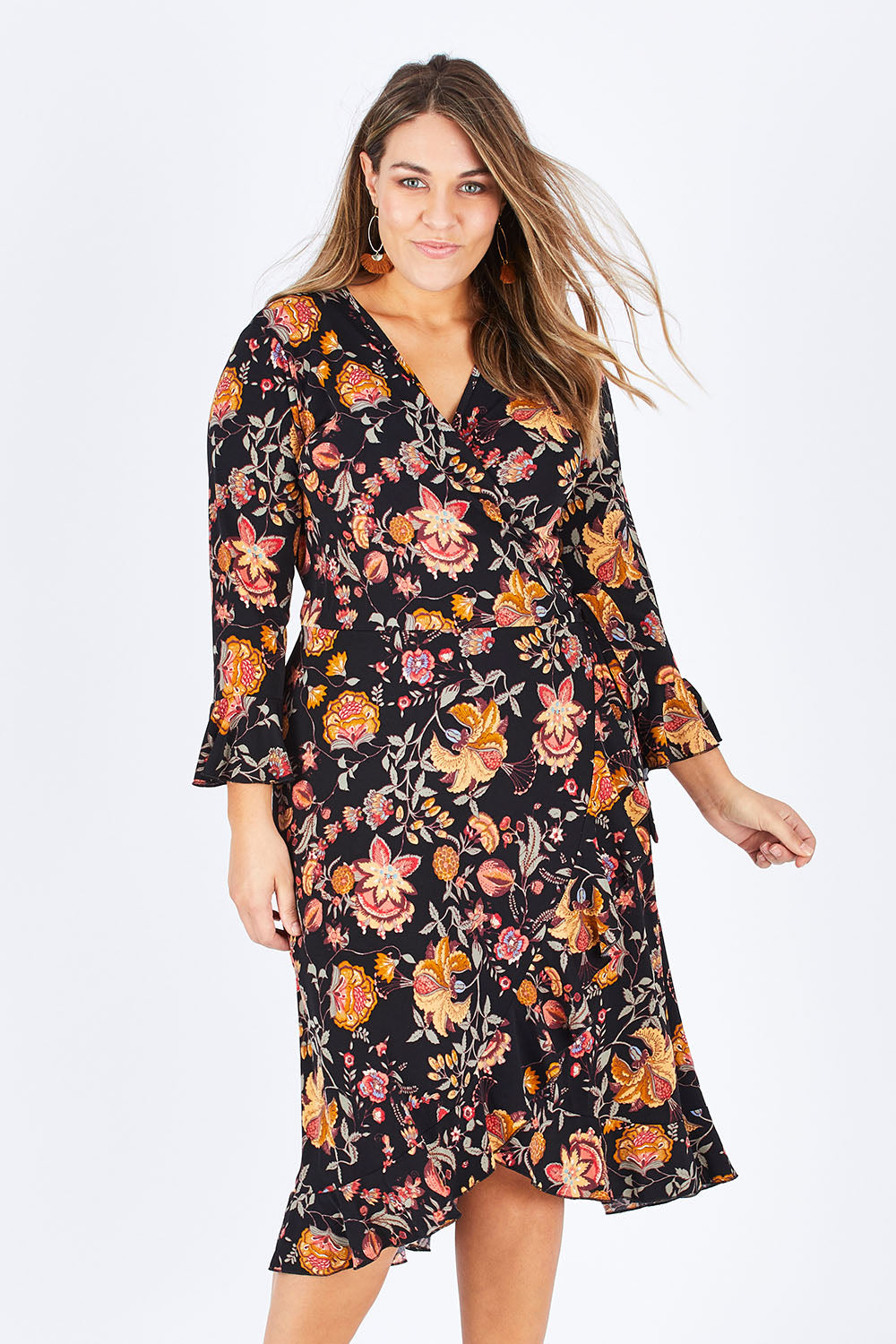 Model Natalia wearing size 14 of the Swanning Around Wrap Dress in colour BlackOrch (Black), from the front, cropped image