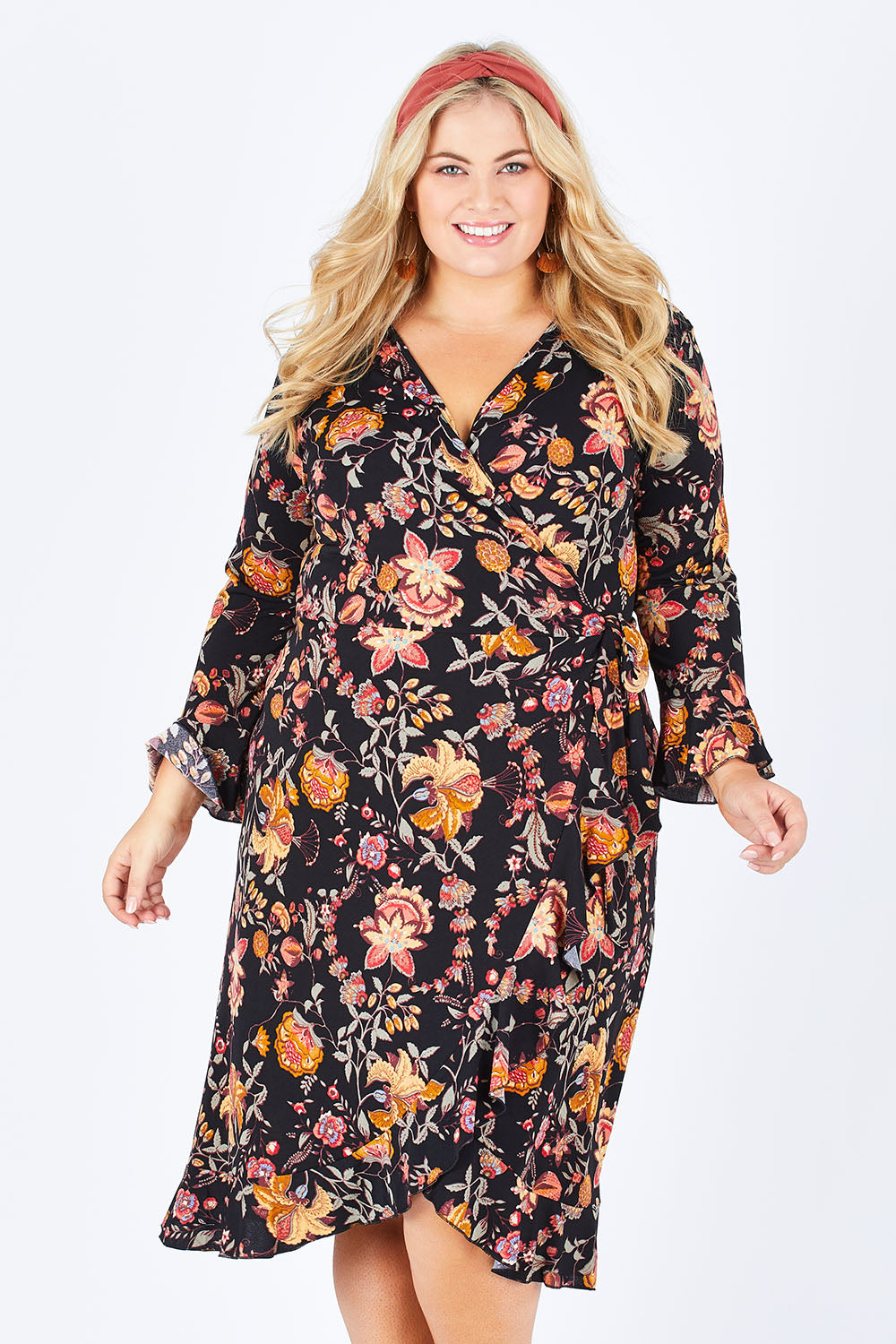 Model Sophie wearing size 18 of the Swanning Around Wrap Dress in colour BlackOrch (Black), from the front, cropped image
