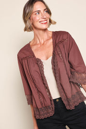 Model Riinar wearing size 10 of the Spring Day Throw – Chocolate in colour Chocolate, from an angle