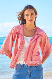 Model Tegan wearing size 10 of the Spring Day Cotton Throw in colour Rose (Pink), from the front, showing the whole outfit