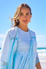 Model Tegan wearing size 10 of the Spring Day Cotton Throw in colour Sky (Blue), from the front, showing the whole outfit