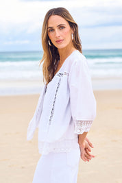 Model Tegan wearing size 10 of the Spring Day Cotton Throw in colour White (White), from the front, showing the whole outfit