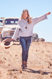 Model Marnee wearing size 10 of the You Patched Me All Up Jeans in colour Denim (Blue), from the front, showing the whole outfit