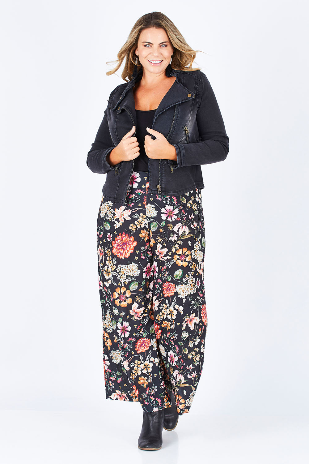 Model Fiona wearing size 16 of the Road Less Travelled Jacket in colour Black (Black), from the front, showing the whole outfit