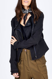 Model Georgia wearing size 10 of the Road Less Travelled Jacket in colour Black (Black), from the front, cropped image