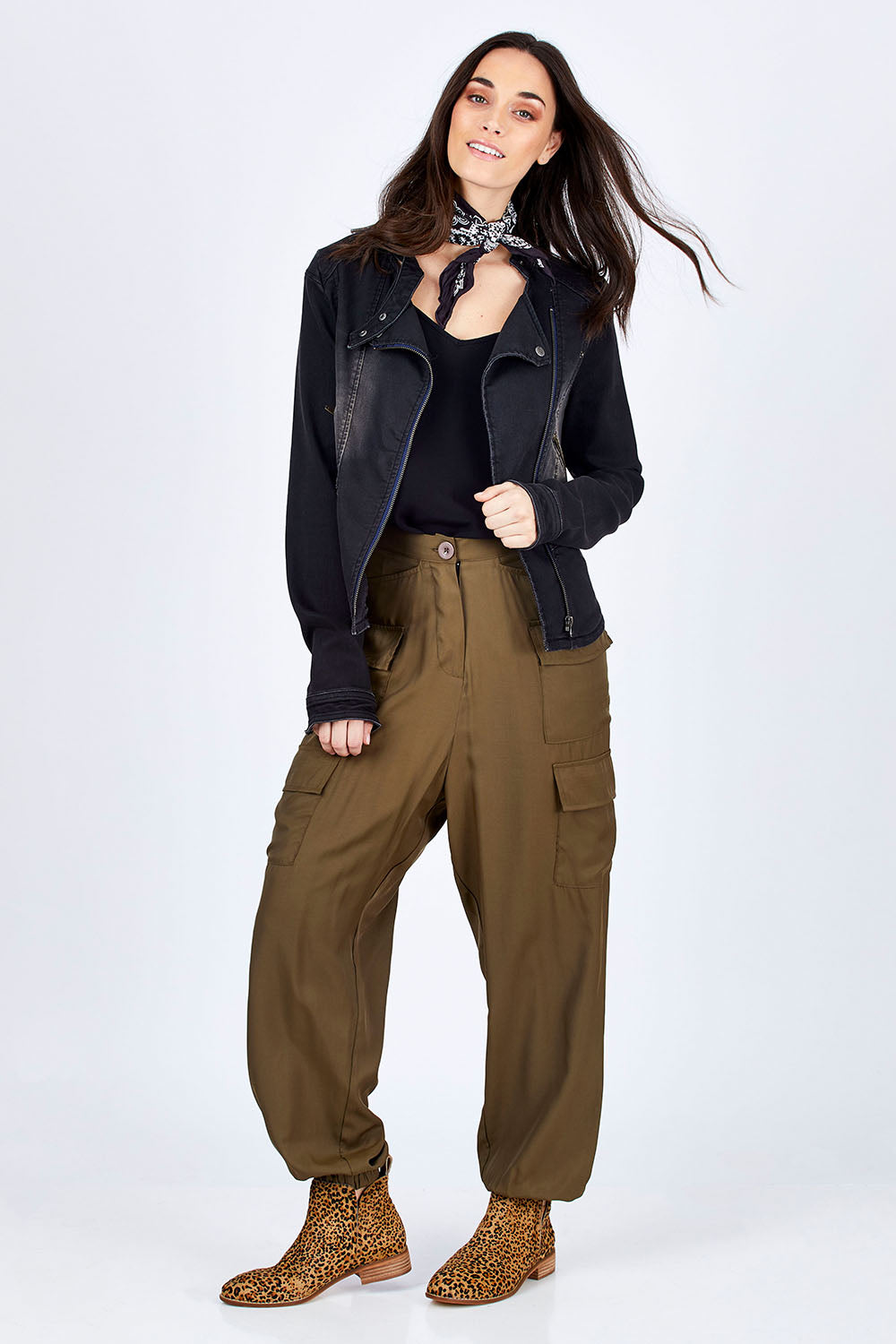 Model Georgia wearing size 10 of the Road Less Travelled Jacket in colour Black (Black), from the front, showing the whole outfit