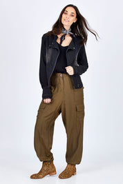 Model Georgia wearing size 10 of the Road Less Travelled Jacket in colour Black (Black), from the front, showing the whole outfit