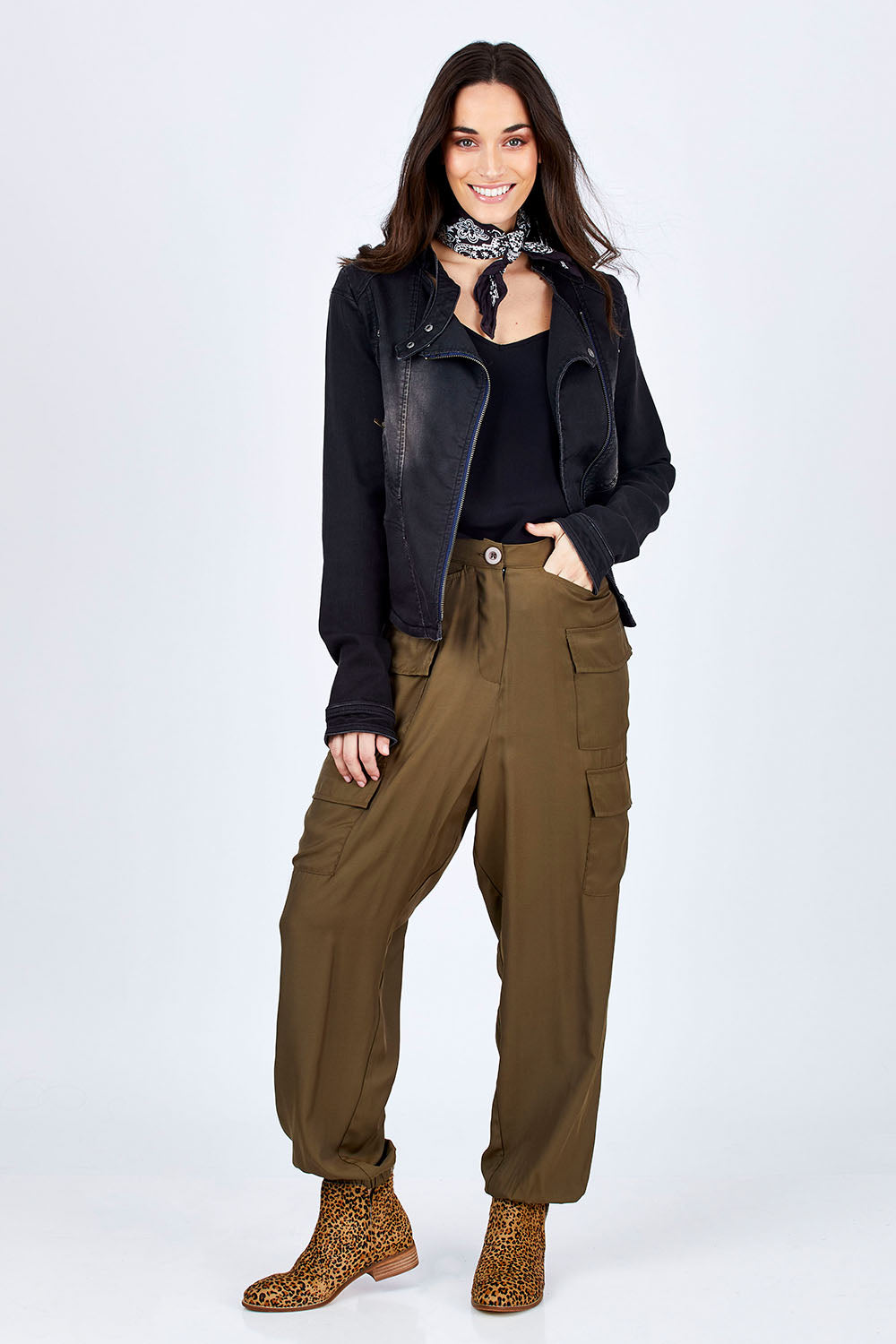 Model Georgia wearing size 10 of the Road Less Travelled Jacket in colour Black (Black), from the front, showing the whole outfit
