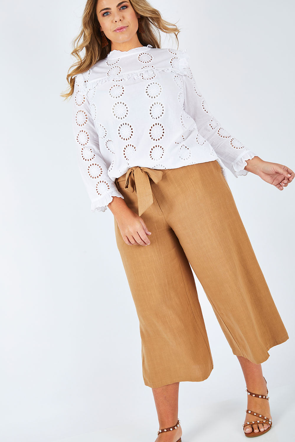 Model Fiona wearing size 16 of the Coyote Wide Leg Linen Blend Pant in colour Camel, from the front, showing the whole outfit