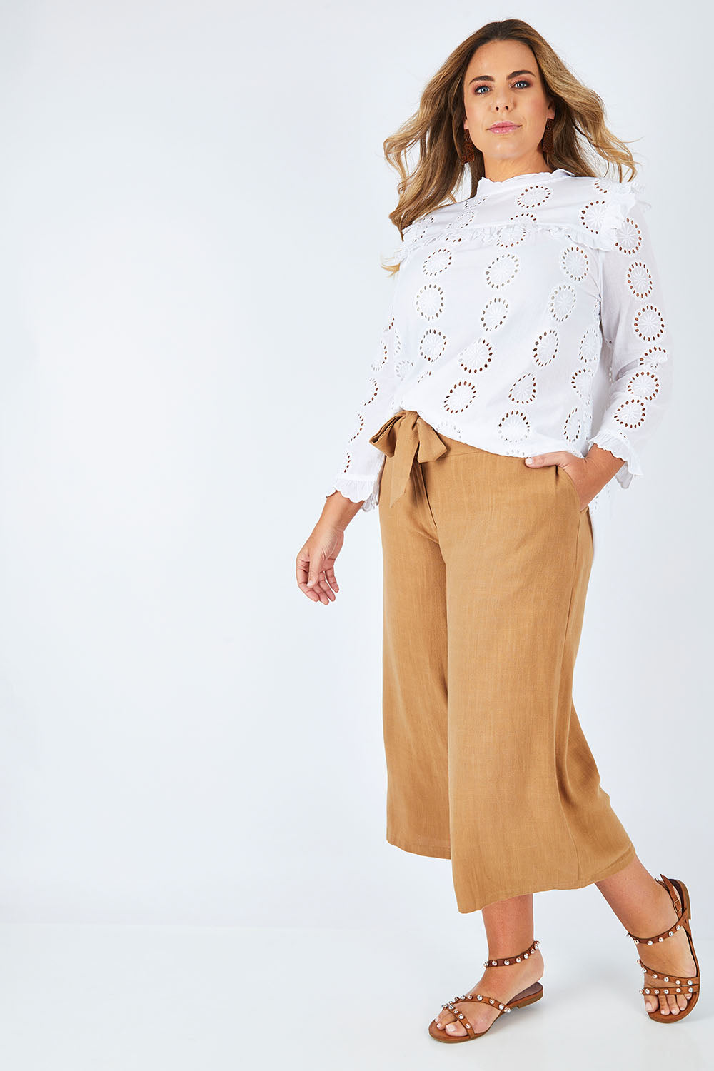 Model Fiona wearing size 16 of the Coyote Wide Leg Linen Blend Pant in colour Camel, from the front, showing the whole outfit
