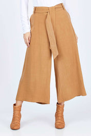 Model Georgia wearing size 10 of the Coyote Wide Leg Linen Blend Pant in colour Camel, from the front, cropped image