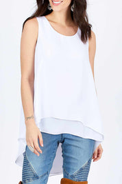 Model Georgia wearing size 10 of the Sugar Snaps Round Neck Layer Tank in colour White (White), from the front, cropped image